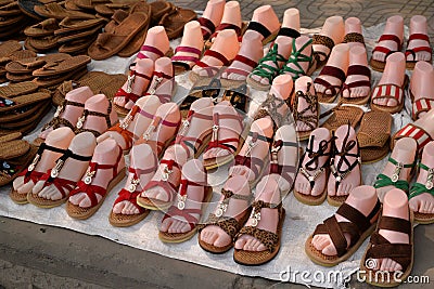 Colorful sandals and shoes for saleã€‚ Stock Photo